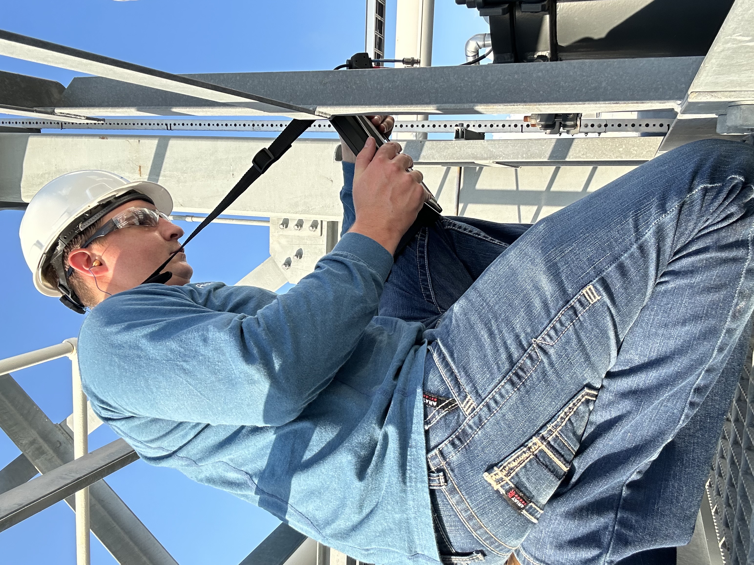 Ryan Smith conducting field diagnostics on industrial equipment